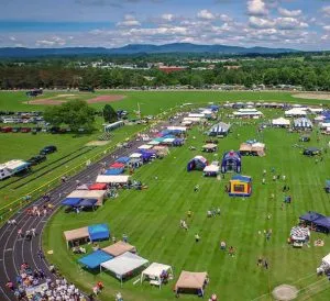aerial photo of a community event in a field